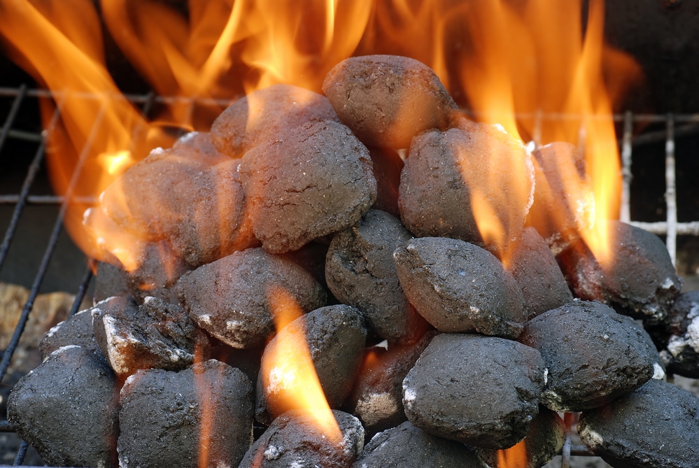 closeup of lit stacked charcoal briquettes 1