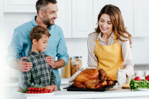a family preparing a Thanksgiving dish