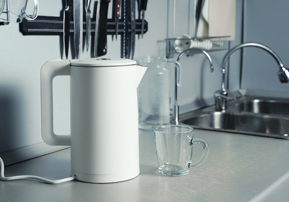 a small appliance and a glass on the countertop