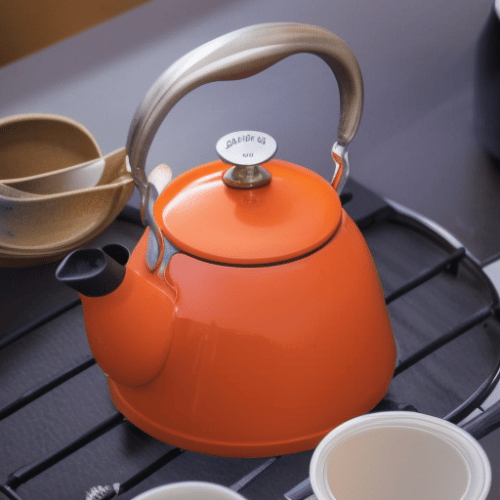 an orange pot with hot water